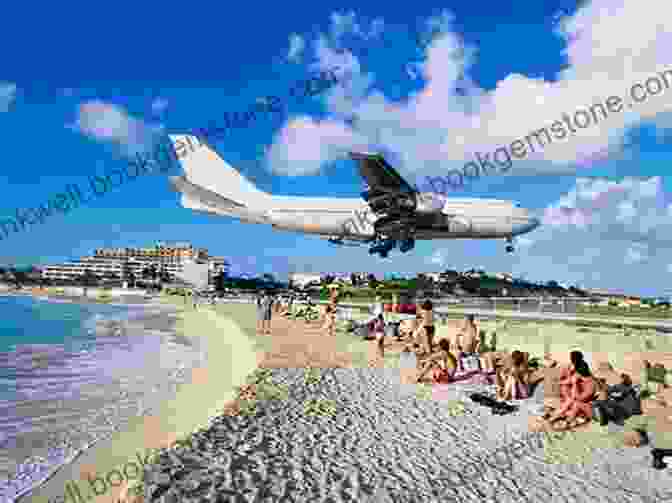 A View Of The Maho Beach In St. Maarten With Airplanes Landing Over The Beach 12MUSTS 2024: The Caribbean Magazine Michelle Lawson